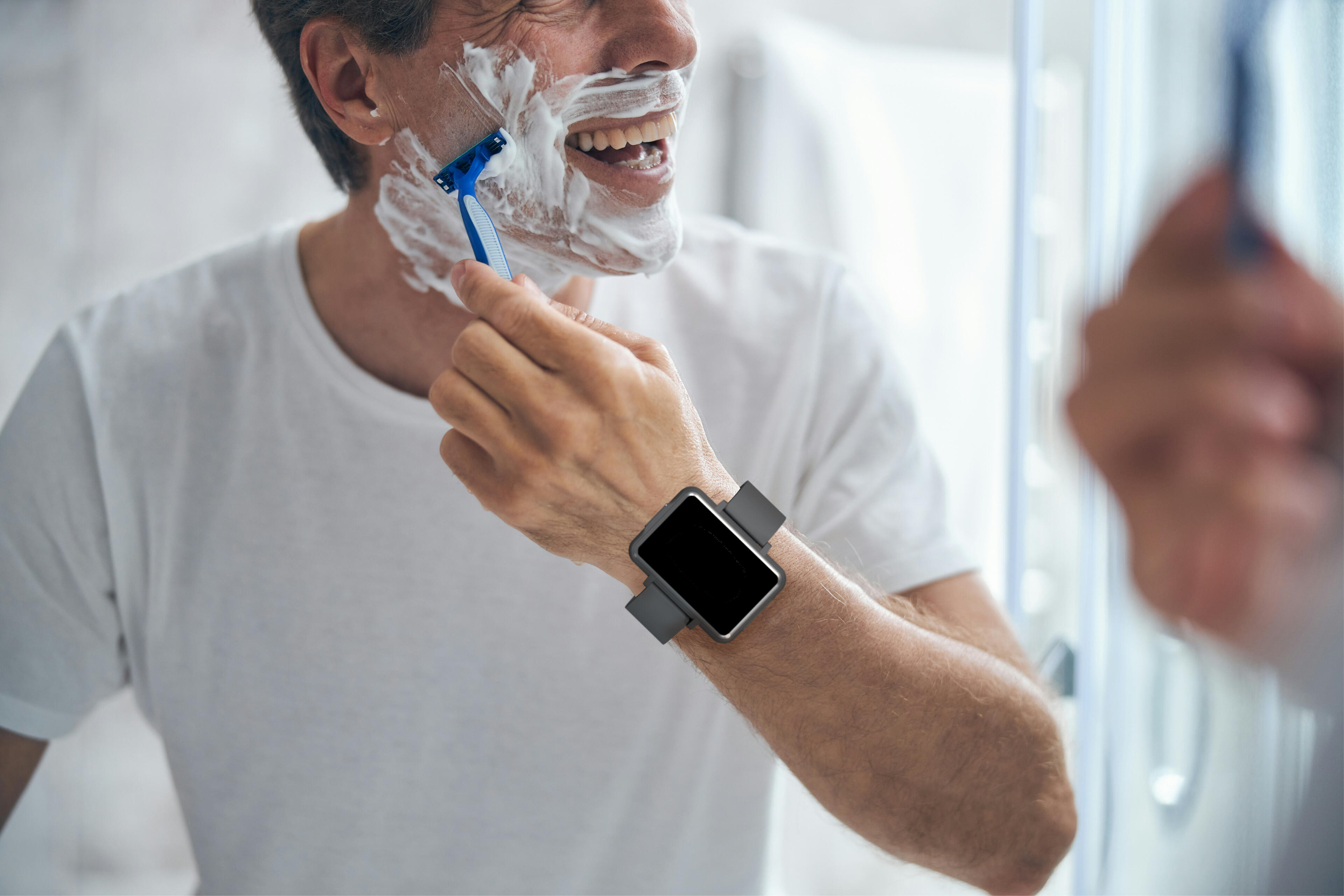 Man shaving while wearing the Cadence band. Man shaving while wearing the Cadence band.